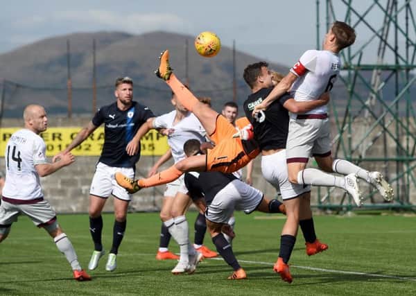 Christophe Berra rises to head the ball into the back of the net but the goal was disallowed. Picture: SNS.