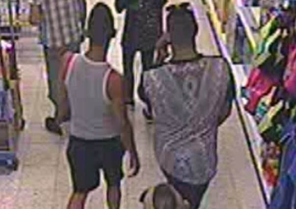 Police released this photo of three men they would like to speak to after a three-year-old boy was seriously injured in a suspected acid attack in a Worcester shop