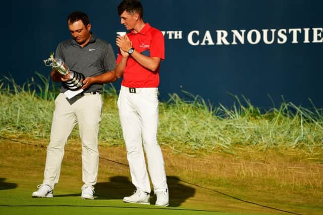 Open champion Francesco Molinari admires the Claret Jug alongside Scotland's Sam Locke, winner of the Silver Medal awarded to the highest placed amateur. Picture: Stuart Franklin/Getty Images