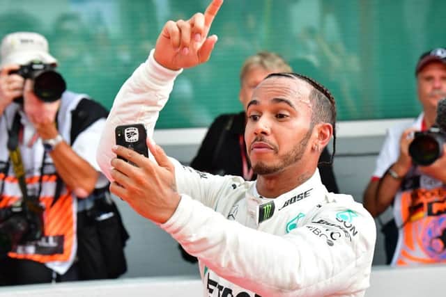 Lewis Hamilton takes a selfie as he celebrates winning the German Grand Prix at Hockenheim yesterday. Picture: AFP/Getty