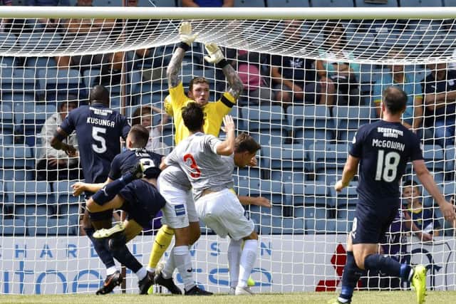 Full-back Jackson Longridge (3) puts Dunfermline in front with a bulleted header. Picture: SNS.