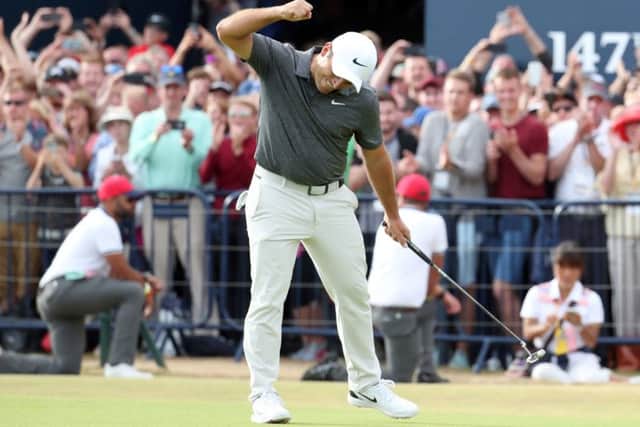 Italy's Francesco Molinari celebrates making birdie on the 18th en route to his Open triumph. Picture: Jane Barlow/PA Wire