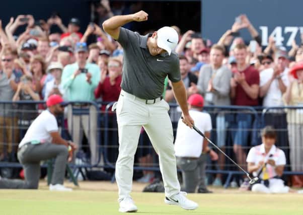 Italy's Francesco Molinari celebrates making birdie on the 18th en route to his Open triumph. Picture: Jane Barlow/PA Wire