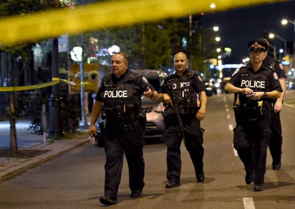 Police at the scene of the shooting. Picture: Nathan Denette/The Canadian Press via AP