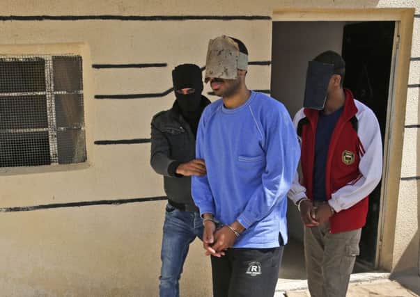 Alexanda Kotey, left, and El Shafee Elsheikh are alleged to have been members of the group calling itself Islamic State. Picture: AP Photo/Hussein Malla