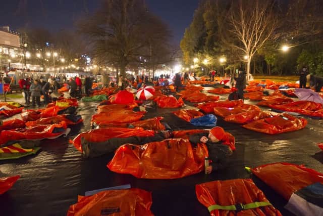 Sleepers bed down for the night in Princes Street Gardens, Edinburgh, during last year's Sleep in the Park