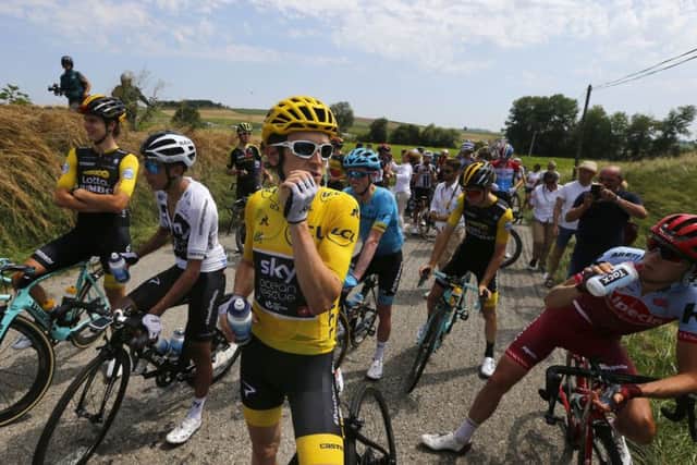 Cyclists wait for the Tour to resume. Picture: AP Photo