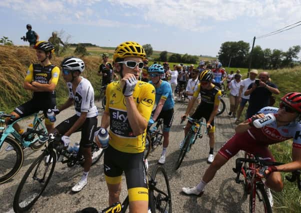 Cyclists wait for the Tour to resume. Picture: AP Photo