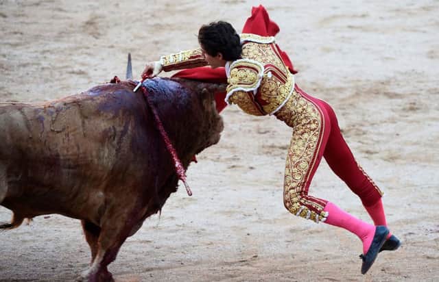 French matador Sebastian Castella stabs a bull in the San Fermin festival in Pamplona, northern Spain (Picture: Jose Jordan/AFP/Getty)
