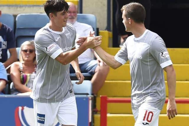 Dunfermline's Jackson Longridge celebrates his goal at Dundee with brother Louis. Picture: Rob Casey/SNS