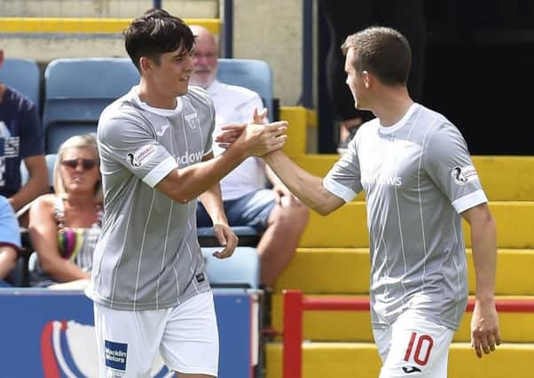 Dunfermline's Jackson Longridge celebrates his goal at Dundee with brother Louis. Picture: Rob Casey/SNS
