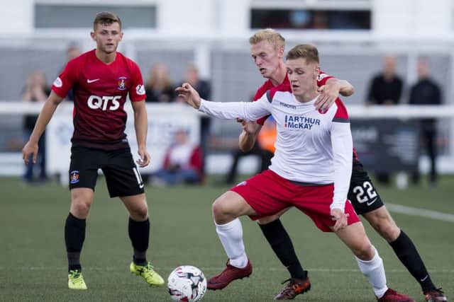Kilmarnock's Ross Millen tracks Spartans' Harry Girdwood. Picture: Bruce White/SNS