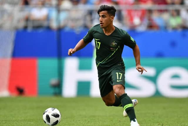 Daniel Arzani runs with the ball during Australia's World Cup Group C match with Denmark. Picture: AFP/Getty Images
