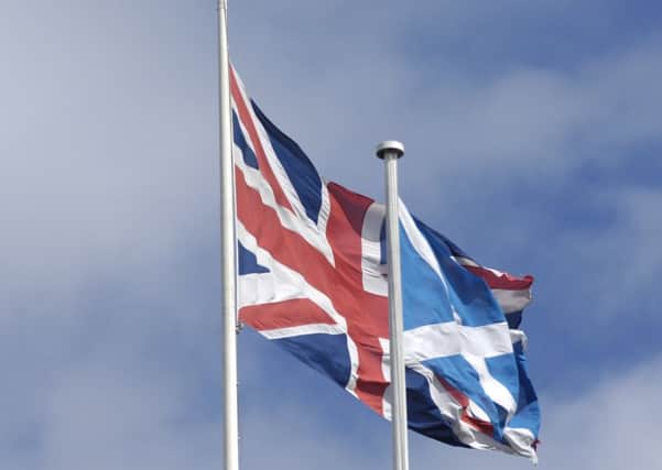 Union Jack and Saltires flying above the  HBOS HQ, on the mound. 
Picture: Neil Hanna