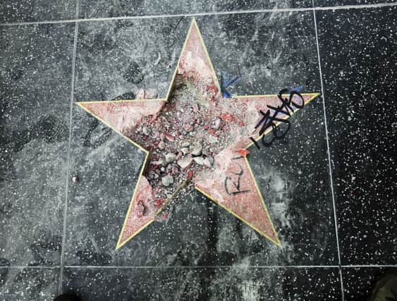 This photo shows Donald Trump's star on the Hollywood Walk of Fame that was vandalized with a pick axe. Picture: AP Photo/Reed Saxon