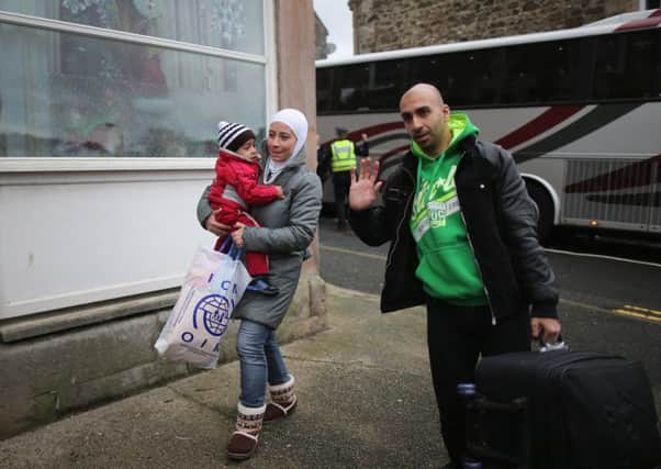 Syrian refugee families arrive at their new homes on the Isle of Bute in December last year. Picture: Christopher Furlong/Getty