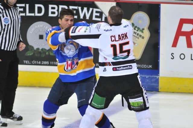 Neil Clark (Sheffield Steelers) and Matt Siddall (Flyers) go toe to toe right from the opening face off (Pic: Richard Davies)