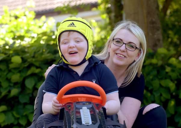 Murray Gray with his mother Karen, who has been campaigning for doctors to be allowed to prescribe medical cannabis (Picture: Lisa Ferguson)