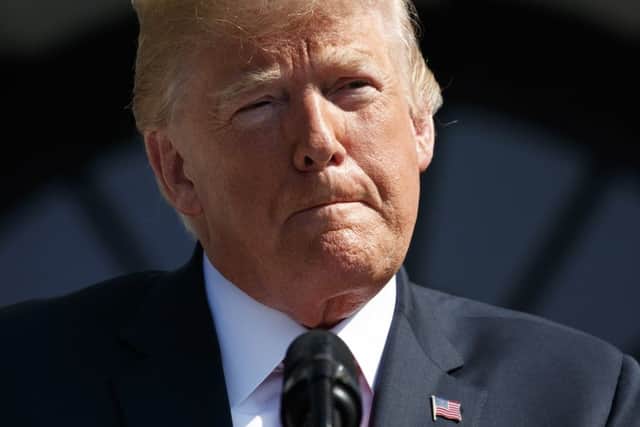 President Donald Trump pauses as he delivers remarks at the White House. Picture: AP Photo/Evan Vucci