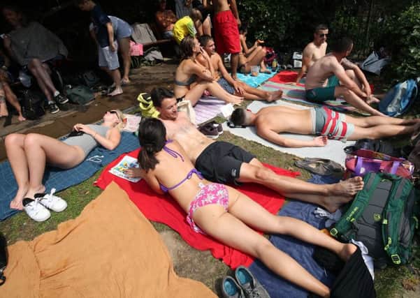 People enjoying the current heatwave. Picture: PA