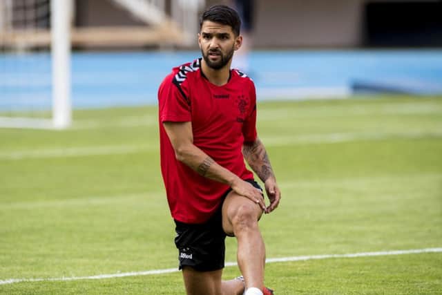 Rangers midfielder Daniel Candeias wears the red top during training. Picture: SNS