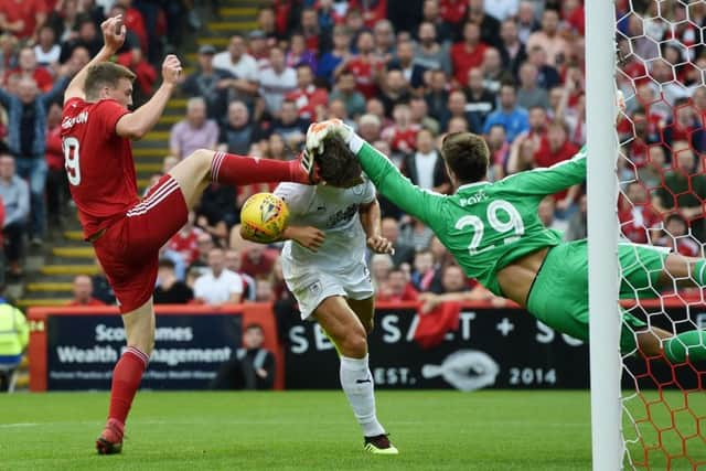 Aberdeen's Lewis Ferguson clashes with Burnley's Nick Pope. Picture: Craig Foy/SNS