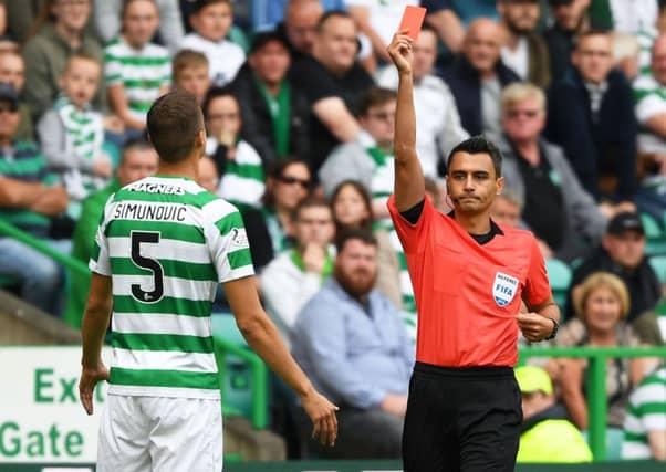 Referee Horatiu Fesnic sends Jozo Simunovic off in the second leg against Alashkert. Picture: SNS