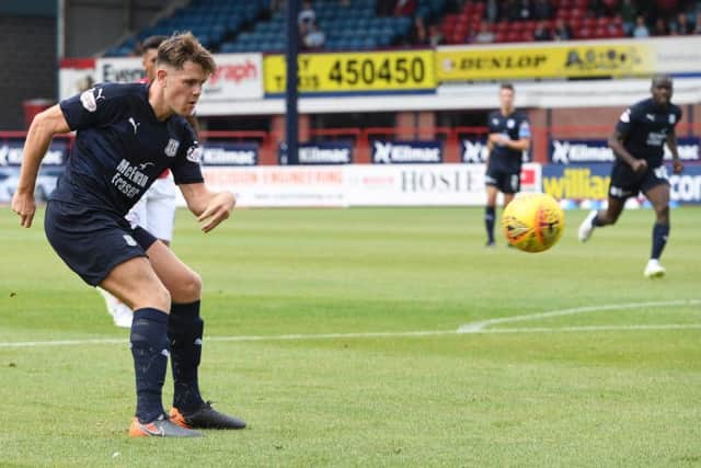 Lewis Spence scores to make it 1-0. Pic: SNS/Ross Parker