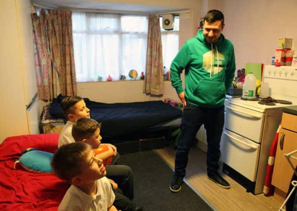 Glenn and his children who are living in an emergency hostel after becoming homeless. Picture: Laurie Garnons-Williams/Shelter/PA Wire