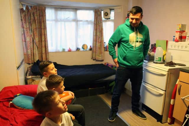 Glenn  and his children who are living in an emergency hostel after becoming homeless. Picture: Laurie Garnons-Williams/Shelter/PA Wire