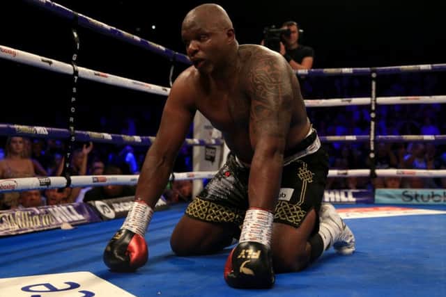 Dillian Whyte is floored by Joseph Parker but recovered to win the fight. Picture: Getty