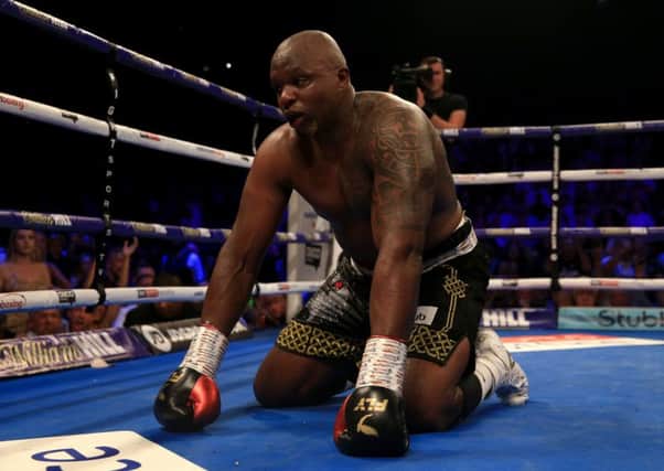 Dillian Whyte is floored by Joseph Parker but recovered to win the fight. Picture: Getty