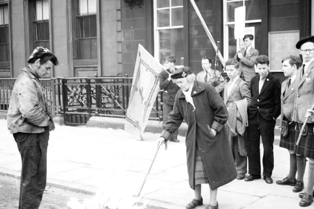 Wendy Wood, founder of Scottish Patriots, leads protest against migration schemes outside  Australia Immigration Office in St Andrew's Square in 1959. PIC: TSPL.