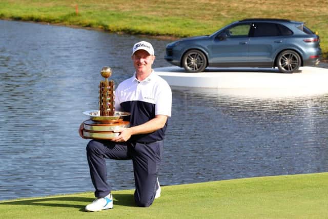 Richard McEvoy poses with the trophy after his victory at the Porsche European Open. Pic: Matthew Lewis/Getty Images