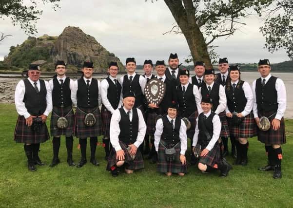 Scottish Borders Pipe Band celebrates its first place in grade 3b at the Scottish Pipe Band Championships held in Dumbarton on Saturday.