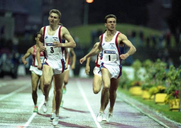Brian Whittle, wearing number three, crosses the finish line with Tom McKean at Meadowbank stadium in 1991. Picture: Graeme Hunter