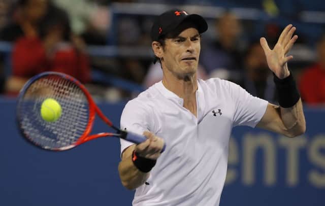 Andy Murray returns against Mackenzie McDonald during the first round of the Citi Open. Picture: AP
