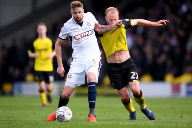 Mark Beevers, left, seen here battling with former Ross County striker Liam Boyce. Picture: Getty