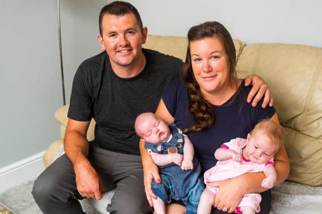 Jennifer Ashwood and Andrew House twins Poppy and Piran House, at their home in Camborne, Cornwall. Picture: SWNS