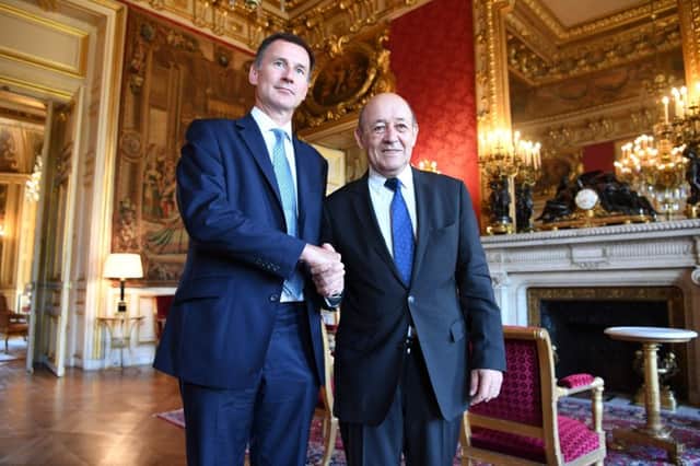 French Foreign Minister Jean-Yves Le Drian, right, shakes hands with his British counterpart Jeremy Hunt before a meeting at the ministry on July 31, 2018 in Paris. Picture: Getty Images