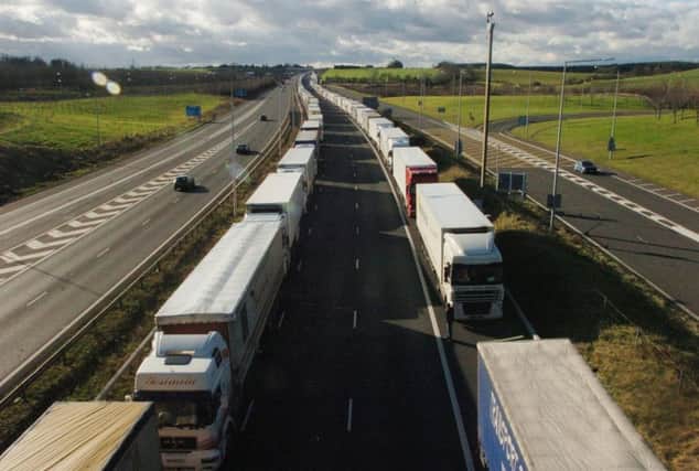 Lorries parked on the M20 in Ashford, Kent, as fresh fears over the impact of a no-deal Brexit have been raised regarding how Channel ports will cope with lorry backlogs. PRESS ASSOCIATION Photo. Issue date: Tuesday July 31, 2018. See PA story POLITICS Brexit Ports. Photo credit should read: Gareth Fuller/PA Wire