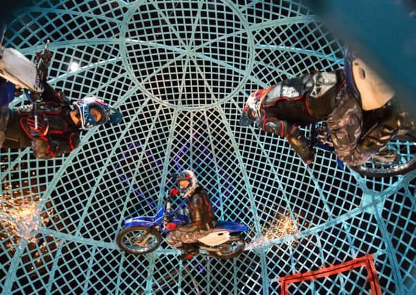 The crazy chaps at Cirque Berserk! in their Globe of Death. Picture: circusphotographer.com