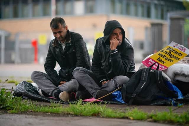 Afghan refugees Rahman Shah and Mirwais Ahmadzai outside the Home Office in Glasgow. Picture: Christopher Furlong/Getty