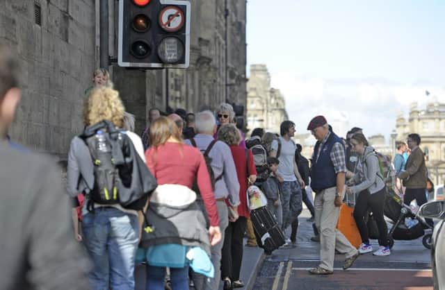 Busy pavements are a familar sight in Edinburgh in August. Picture: Neil Hanna