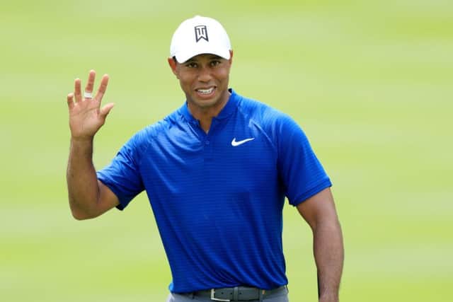 Tiger Woods acknowledges the crowd at Firestone Country Club. Picture: Sam Greenwood/Getty