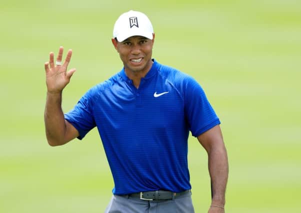 Tiger Woods acknowledges the crowd at Firestone Country Club. Picture: Sam Greenwood/Getty