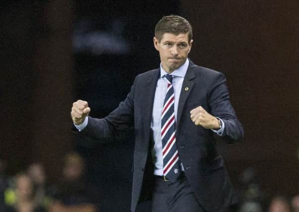 A mixture of pleasure and relief as Rangers manager Steven Gerrard reacts to the final whistle. Picture: PA.