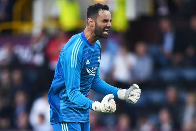 Aberdeem keeper Joe Lewiis celebrates Lewis Ferguson's goal against Burnley. Picture: Nathan Stirk/Getty