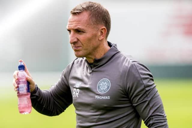 Celtic manager Brendan Rodgers says todays opposite number, Kenny Miller, inset, will learn from his early difficulties. Picture: SNS.