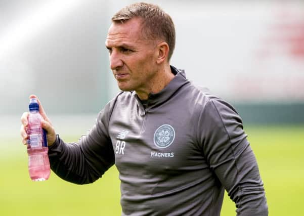 Celtic manager Brendan Rodgers says todays opposite number, Kenny Miller, inset, will learn from his early difficulties. Picture: SNS.